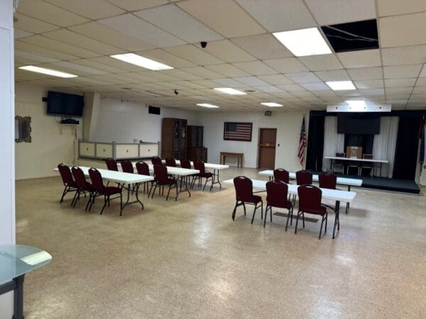 A room with tables and chairs in it