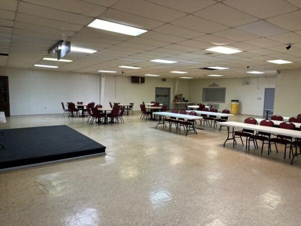 A room with tables and chairs in it