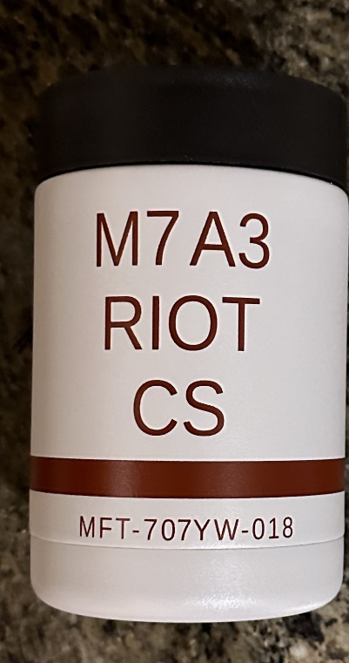 A close up of the words " riot cs " on a coffee mug.