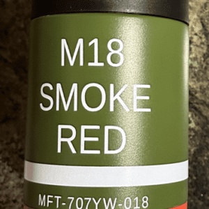 A can of smoke red paint on the side of a wall.
