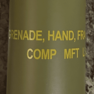 A close up of the words on a military type grenade