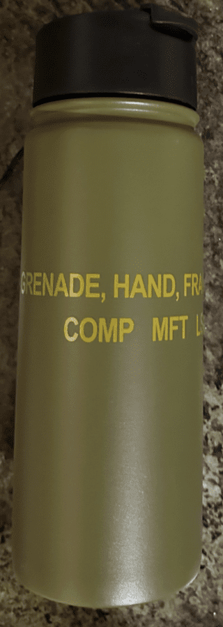 A close up of the words on a military type grenade